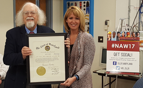 Maryland Labor Secretary Kelly Schulz presented John Taylor with the Governor's Citation